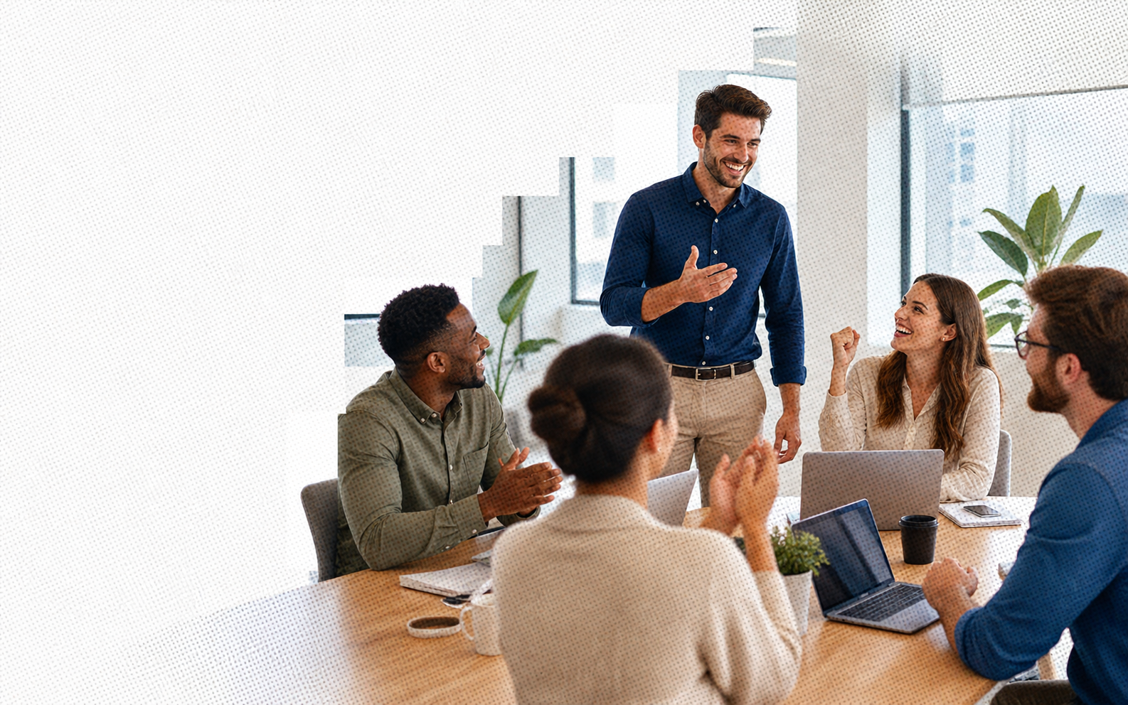 Smiling sales team in a meeting after closing a qualified opportunity
